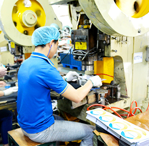 Employees working on tin box production line